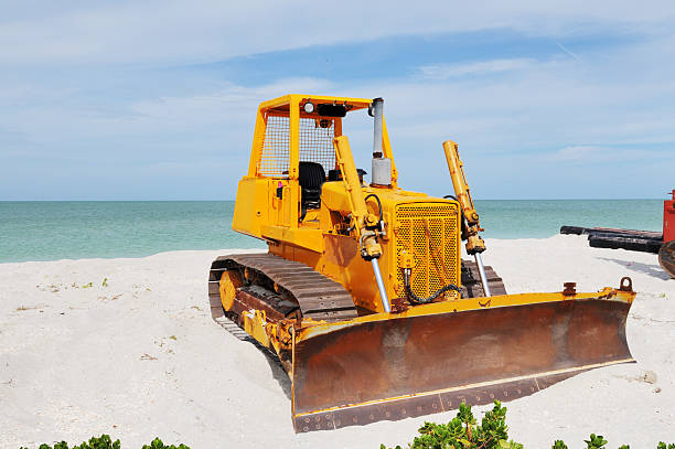 Kuta, Badung, Bali, Kuta Beach Indonesia - 4, January 2021: Tractor technic for cleaning the sea beach from garbage stands on the sand after throwing plastic garbage from the sea on the island of Bali in the city of Kuta