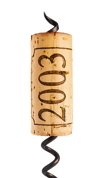 istock Red wine cork and corkscrew on white 174931527