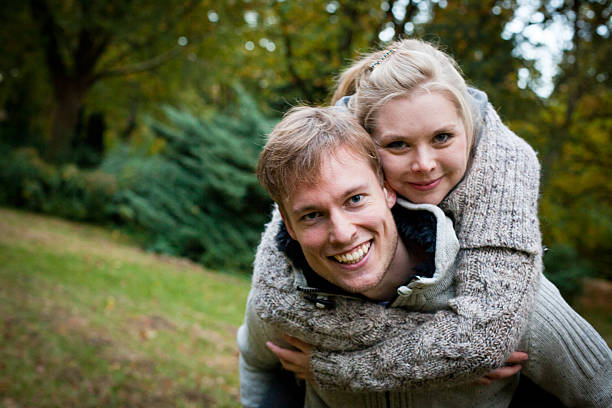 istock amorous couple with fun in the park 174931610