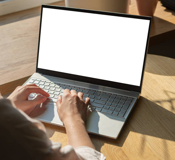 istock Hands at laptop with screen mockup, empty blank clean display mock upp 1749318744
