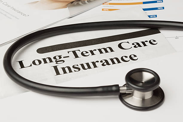 Long-Term Care Insurance Policy Long-term care insurance information, form and stethoscope.   long stock pictures, royalty-free photos & images