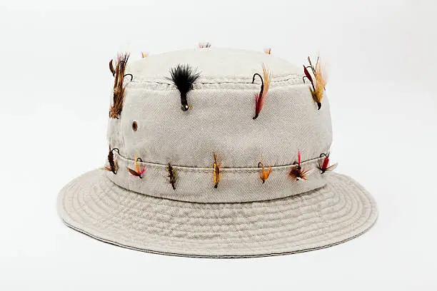 Photo of Bucket Hat with Fly-Fishing flies, Isolated on white background.