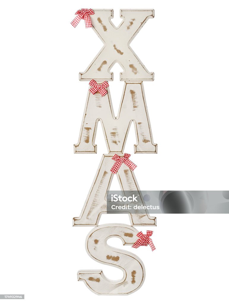 xmas Xmas wooden letters. Written from top to bottom. Brown Stock Photo