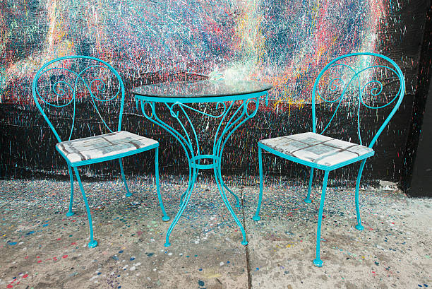 Table And Chairs In Front of Painted Wall