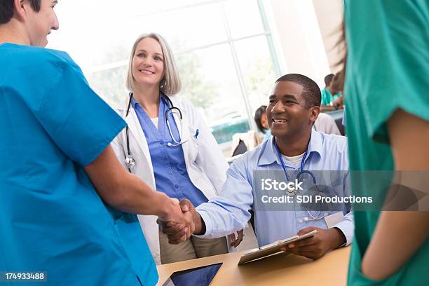 Medical School Professor Welcoming College Student To Lecture Stock Photo - Download Image Now