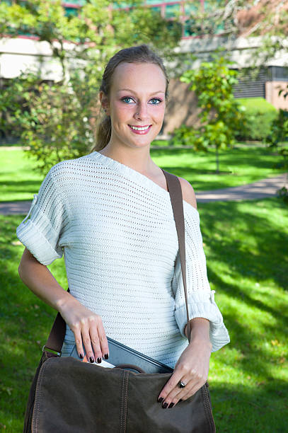 Beautiful College Student with a Book Bag or Purse.