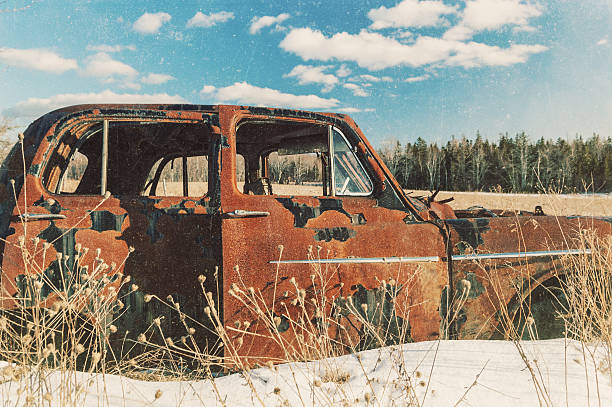 покинутый седан - vehicle door textured effect side view sunlight стоковые фото и изображения