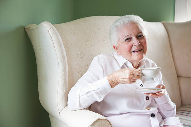 istock Elderly woman with cup of tea 174934423