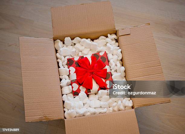 Gift In Box Of Packing Foam Stock Photo - Download Image Now - Cardboard Box, Gift, High Angle View