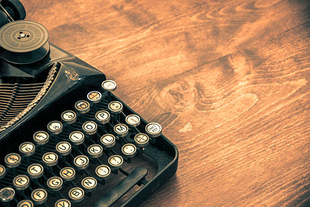 istock Old Vintage Typewriter on Wood Table with Copy Space 174935072