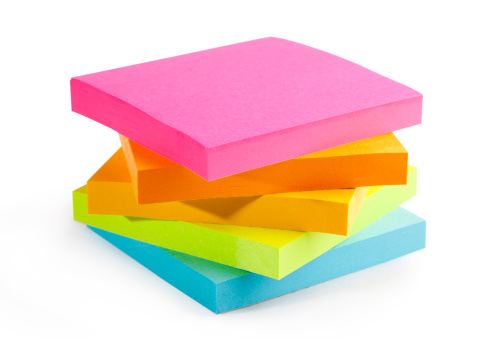 A stack of multi-colored sticky notes isolated (with clipping path) on white background.