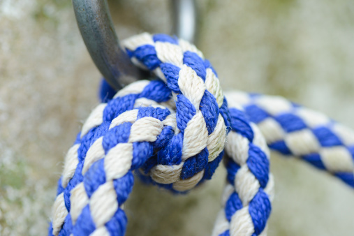 toy for dog made of durable cotton rope on a neutral background