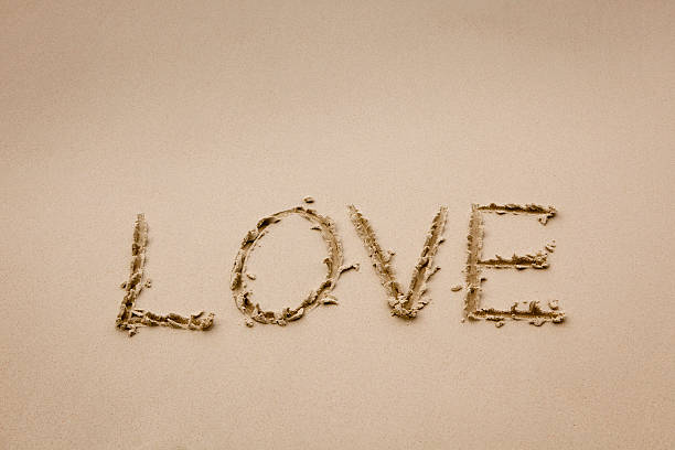 istock Love written in the sand 174937176