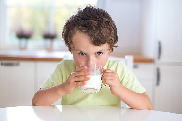 istock portrait of small boy drinking milk 174937215