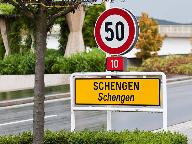 Schengen sign entering the city Schengen in Luxembourg - for more signs schengen agreement photos stock pictures, royalty-free photos & images