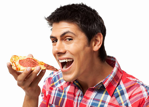 istock Man Eating Slice Of Pepperoni Pizza - Isolated 174937482
