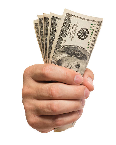 istock Man's Hand with Hundred Dollar Bills Isolated on White Background 174938144