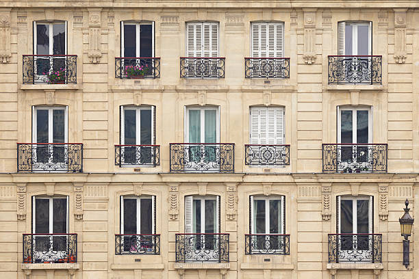 Frontal view of beautiful Parisian Windows and balconies stock photo