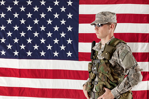 istock Military man posing in front of American flag 174938939