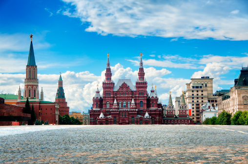 View of the Moscow Kremlin and saint basil cathedral from bridge over the Moskva River, Russia. Moscow / Russia - August 28, 2023