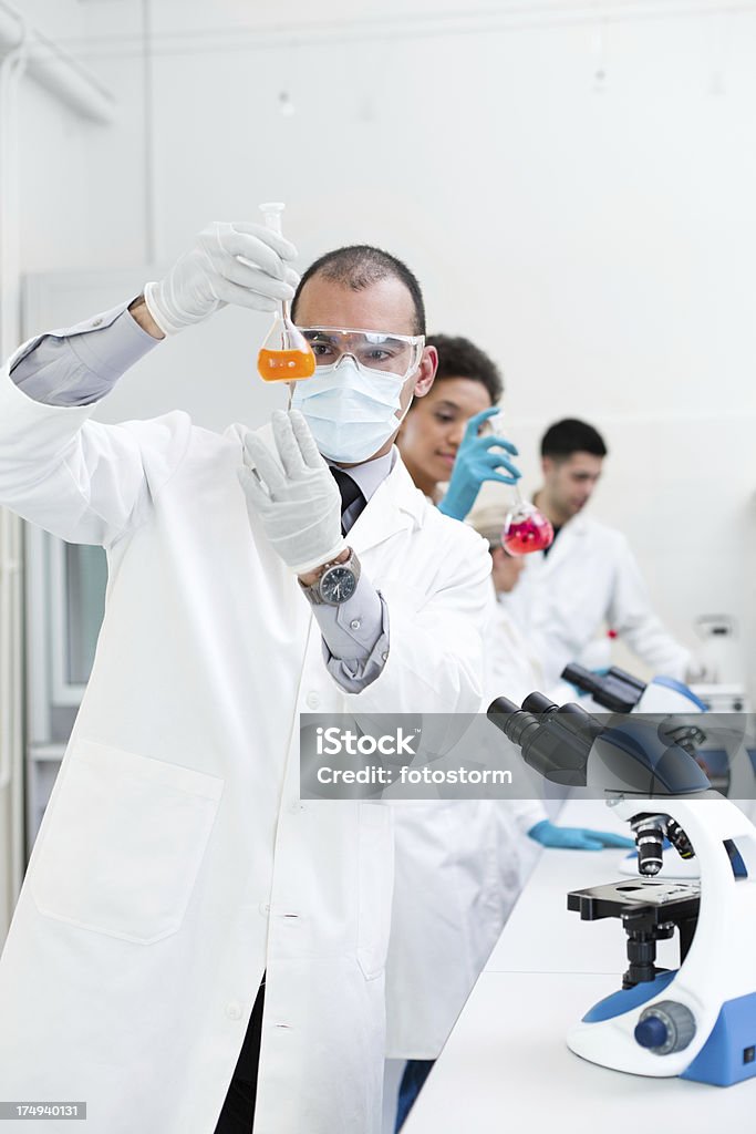 Laboratory teamwork Team of scientists working in a laboratory. Adult Stock Photo