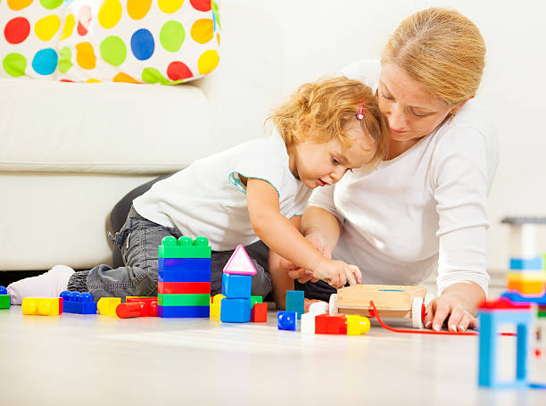 istock Mother and child building with blocks. 174940283