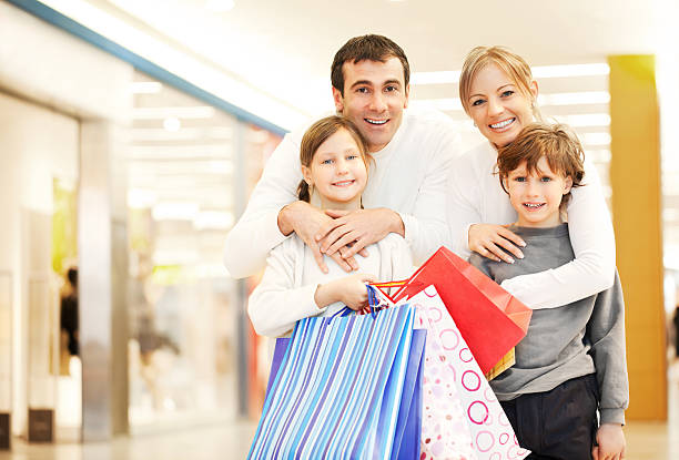 istock Young family enjoying while shopping. 174940553