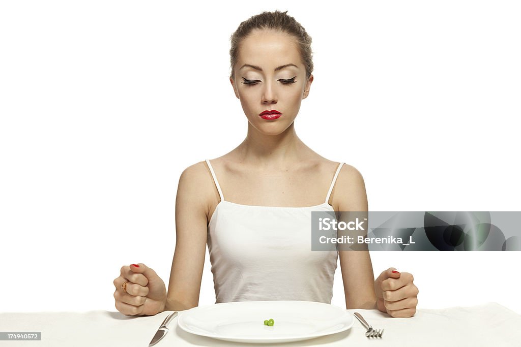 Affamato giovane donna su una dieta - Foto stock royalty-free di Adulto
