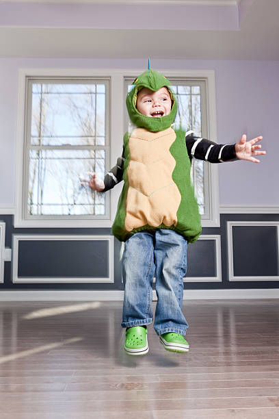 Young Boy in Costume Jumping
