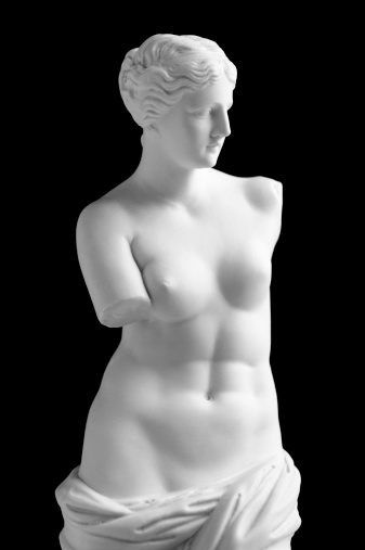 Vintage copy statue of Venus (Aphrodite) de Milo. Vintage-styled fine art image isolated (in camera) on a pure black background. The background can easily be extended to suit your project. Soft lighting with excellent detail. A small amount of grain has been added.