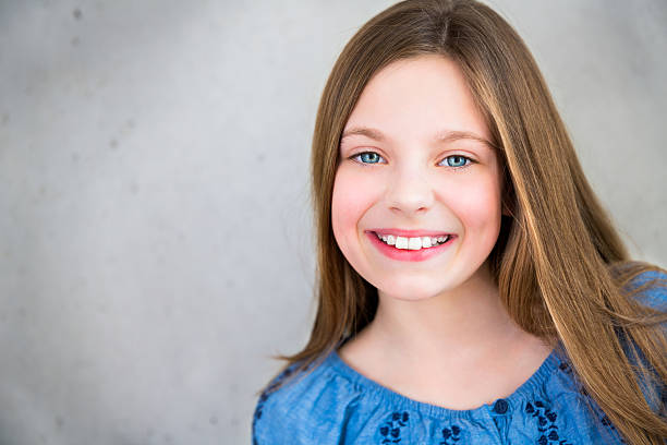Smiling Girl Looking Into Camera Stock Photo - Download Image Now