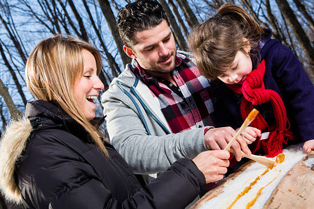 istock Family eating sap on snow 174942154