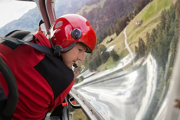 Photo of Happy Swiss Male Pilot Flying Helicopter