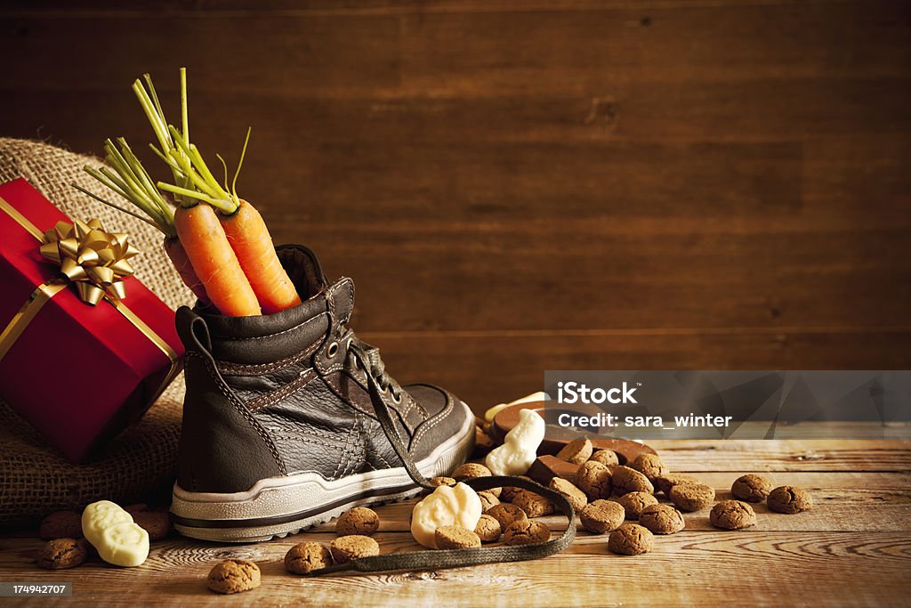 Shoe with carrots, for traditional Dutch holiday 'Sinterklaas' Traditional scene for the Dutch holiday 'Sinterklaas'. Shoe Stock Photo
