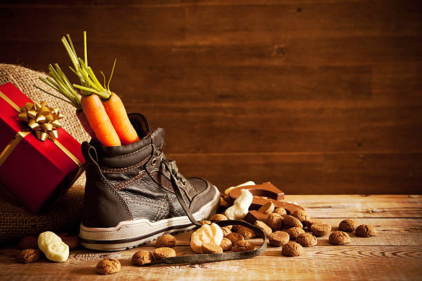 Shoe with carrots, for traditional Dutch holiday 'Sinterklaas' Traditional scene for the Dutch holiday 'Sinterklaas'. textual symbol stock pictures, royalty-free photos & images