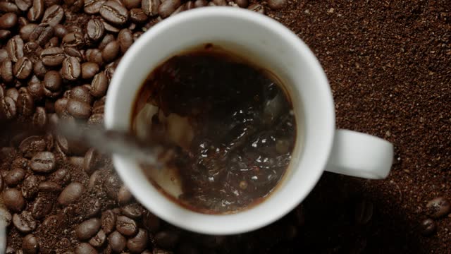 Coffee is poured into a mug