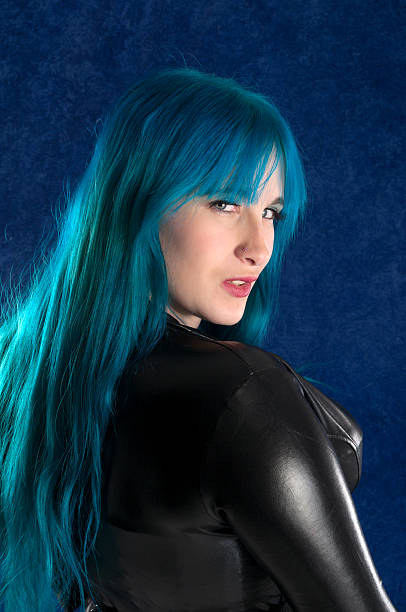 istock Blue haired woman in black looking over shoulder. 174942973