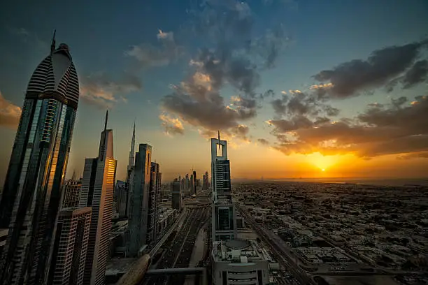 "Sheikh Zayed Road Sunset with the Palm Jumeirah, Burj Al Arab and the Marina highrise in the background."