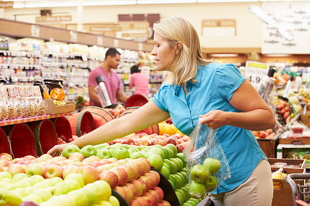 istock Woman At Fruit Counter In Supermarket 174943407
