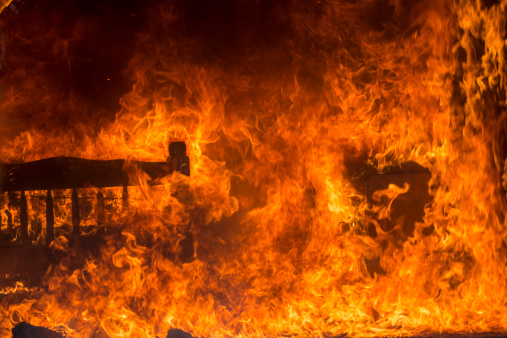 Bed Room On Fire.  This stock image has a horizontal composition.