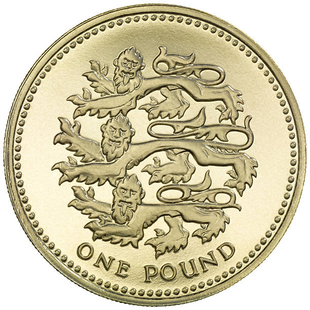 английская монета 1 фунт "трех львов" - uk british coin coin shiny стоковые фото и изображения