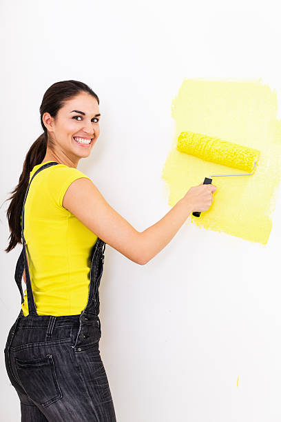 istock Woman painting wall 174943684