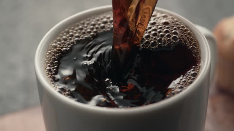 Coffee is poured into a mug