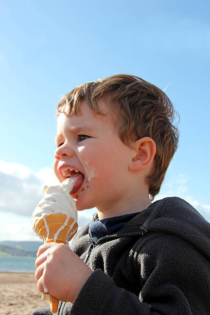 istock Child eating messy ice cream 174943807