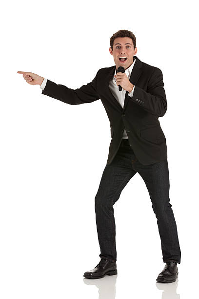 istock Businessman speaking into a microphone 174945038