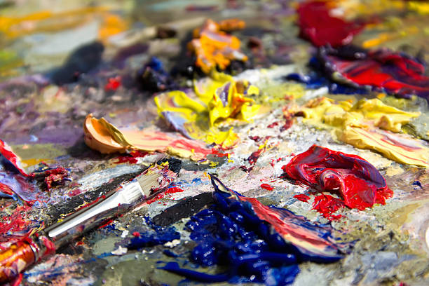 istock mixing oil paints with a brush 174945126