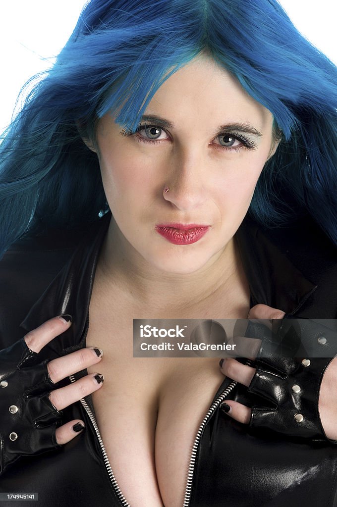 Blue haired woman with hands on chest "Vertical studio shot on white of blue eyed, blue haired beauty." 20-29 Years Stock Photo