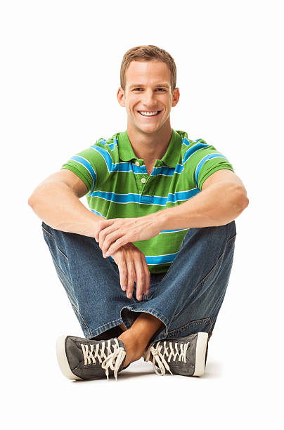 istock Relaxed Young Man Sitting On Floor - Isolated 174945273