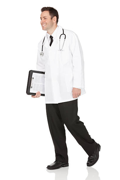 istock Male doctor carrying a clipboard 174945706