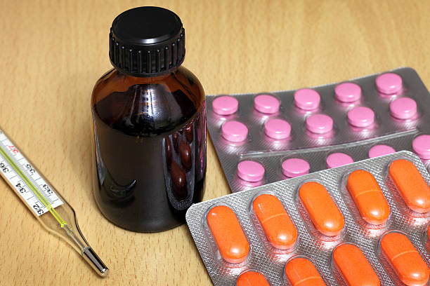 istock Medicine Bottle, pills and thermometer 174945751